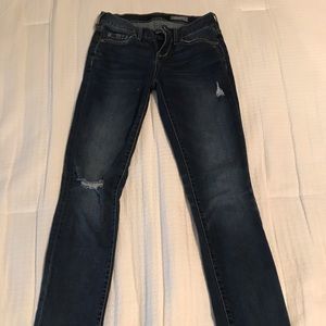 Distressed medium wash skinny jeans